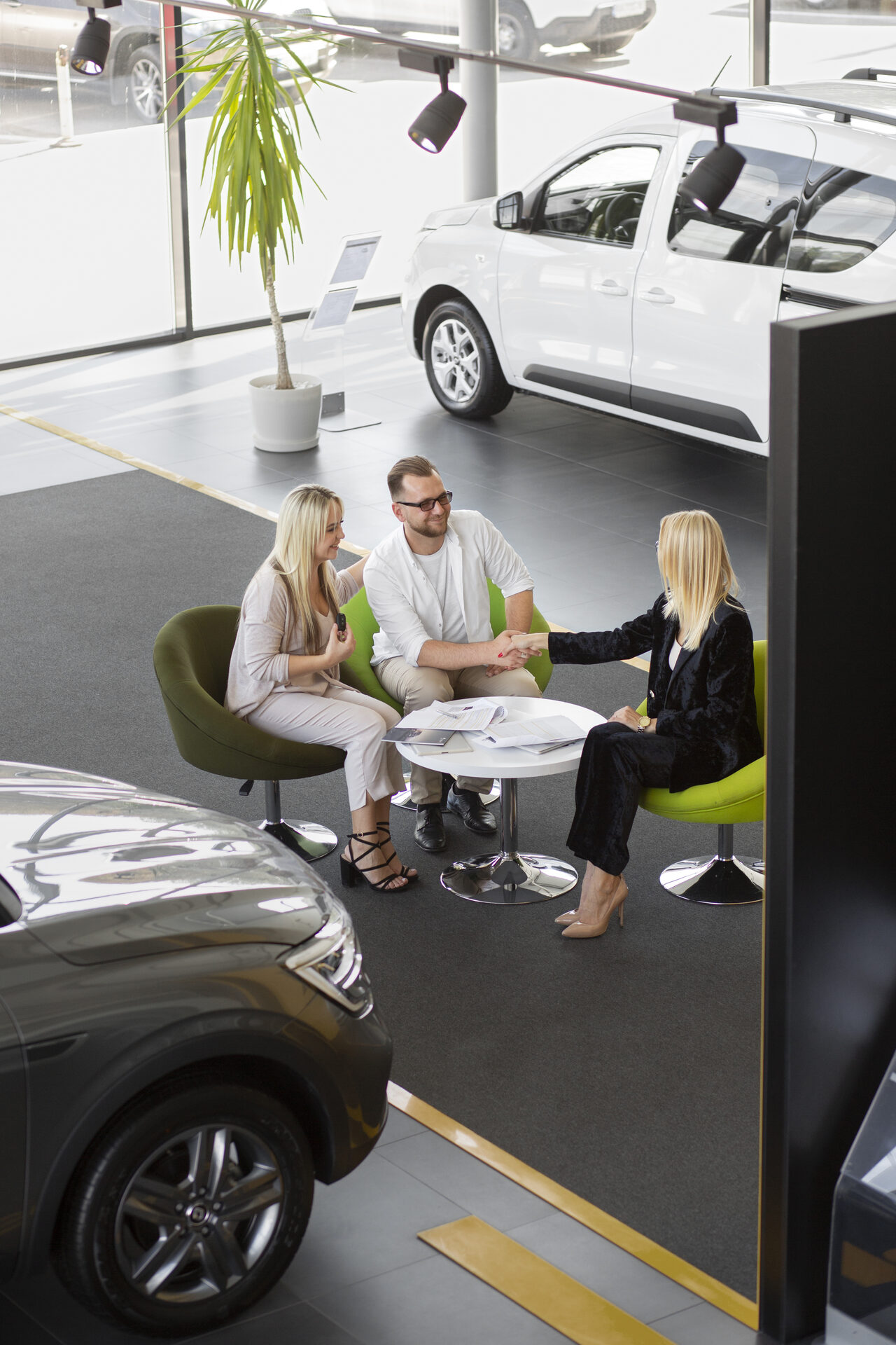 Happy customers at dealership